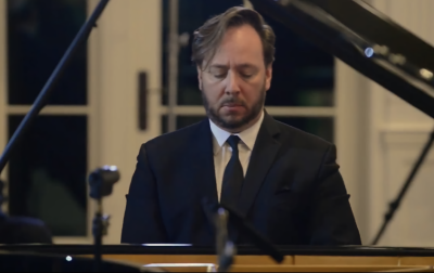 Photo of Thomas Pandolfi playing a piano